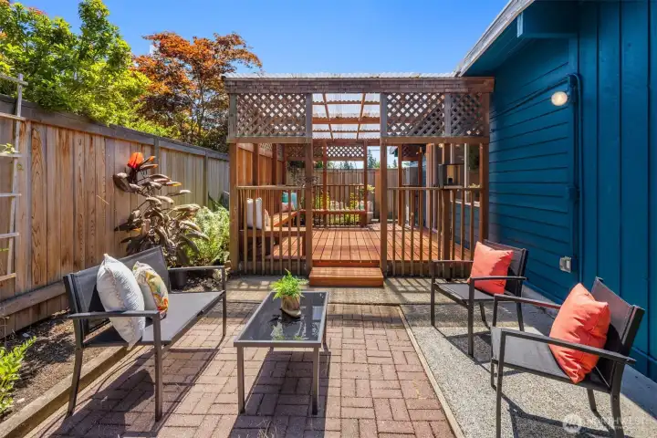 Looking From Additional Brick Patio to Covered Deck and Front Brick Patio