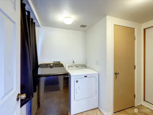 Laundry/utility room on lower level.