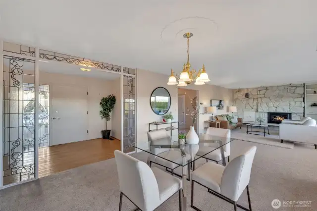 Beautiful lead glass panel at the entry leads you into the dining and living room with wonderful views.