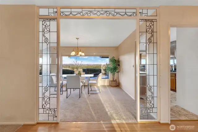 Foyer framing the entry to the dining room - the glass lead glass panels create an elegant entry. Come in and see this view!