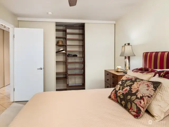 The master bedroom features a wall of custom designed closet systems for all of your favorite items.