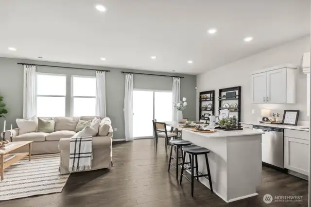 Gather in this comfortable open-concept main floor. Pictures are representative of Burnham floorplan. Colors and options will vary. Photos from Model Home on 30.