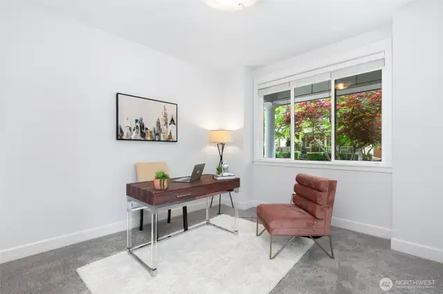Office peacefully overlooks grand columned front porch.