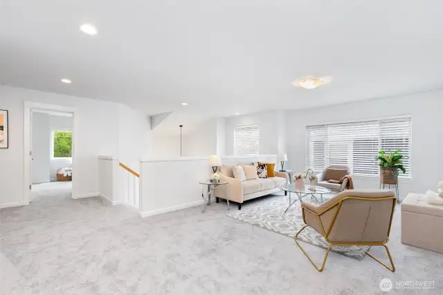 Versatile loft filled with natural light—easily convertible into an additional enclosed room, if desired.