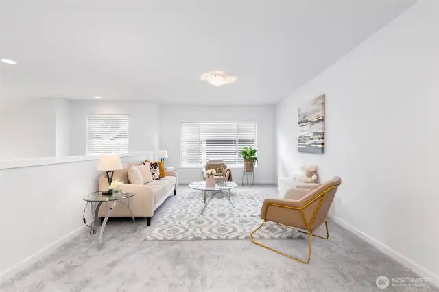 Versatile loft filled with natural light—easily convertible into an additional enclosed room, if desired.