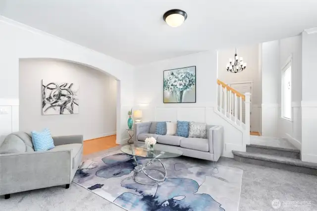 Elegant wainscoting flows from office to formal living. Gleaming maple hardwood floors extends from foyer to hallway, kitchen & family room.
