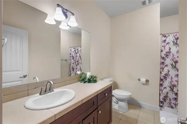 Main floor guest bathroom with shower.