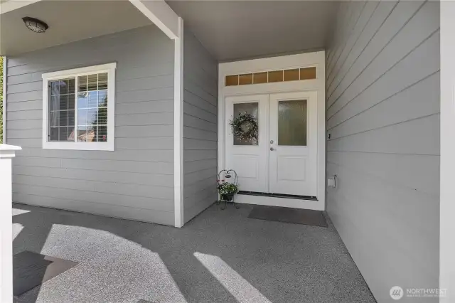 Covered front porch with French doors.