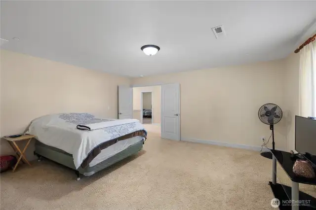 French doors lead to large primary suite.
