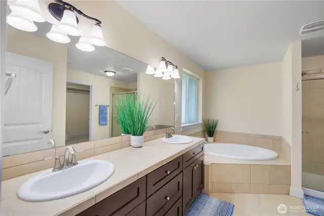 Primary 5-piece bathroom with garden tub, and separate shower.