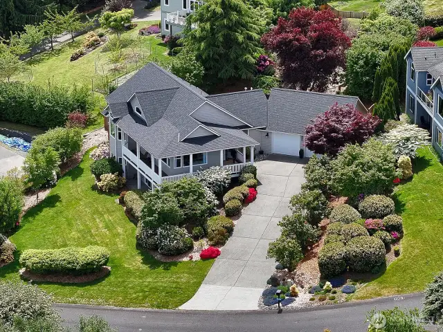 Gorgeous mature landscaping covers the just shy half acre property