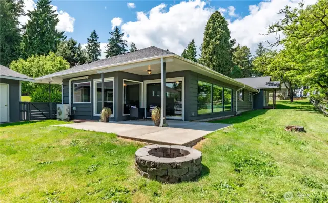 covered patio and firepit off dining room