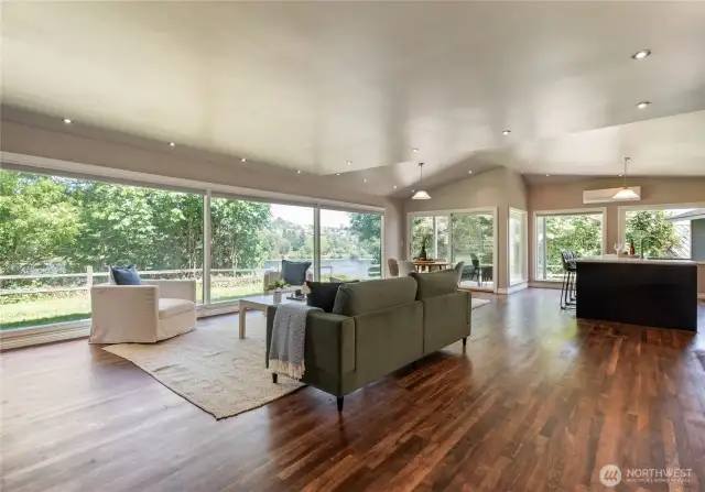 Greatroom with hardwood floors and expansive windows