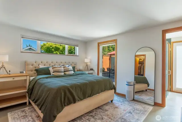 Primary bedroom with designated private access to back patio.