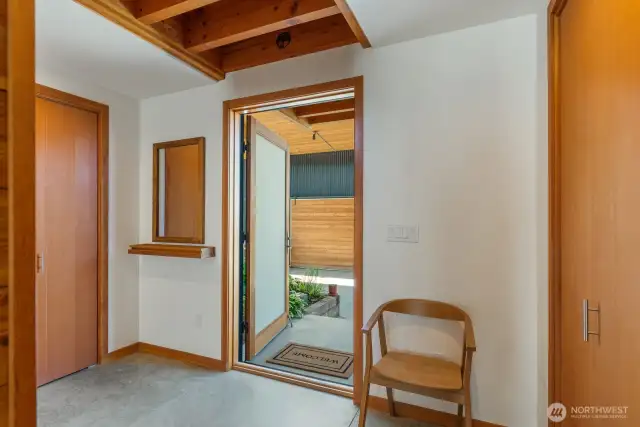 Main entry with built in closet storage.