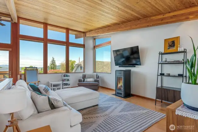 Natural gas fireplace with views and so much natural light flood the living room area.