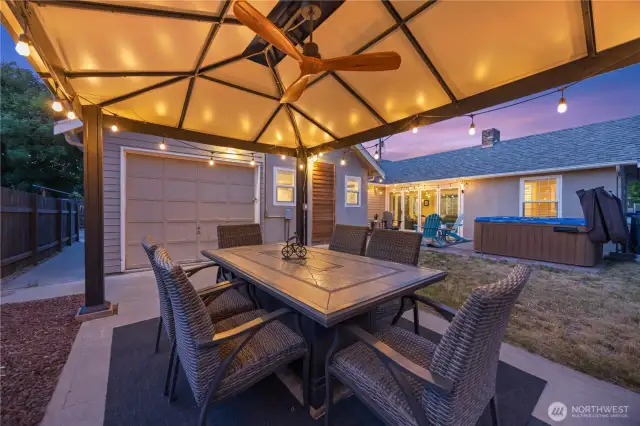 Gazebo seating with fan and fire table.