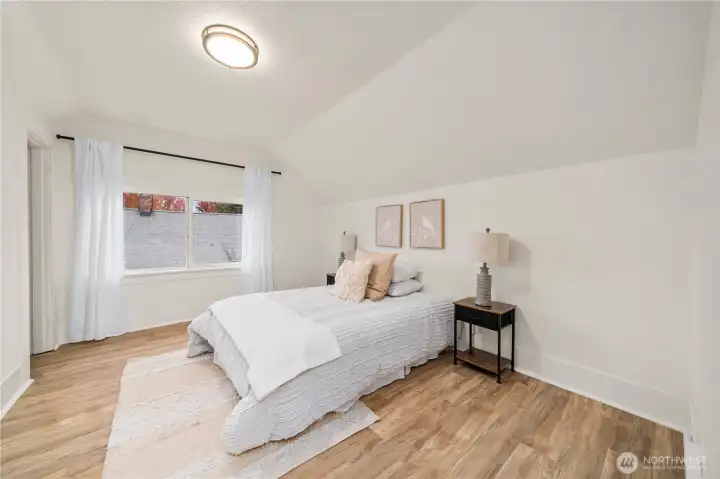 Upstairs bedroom (right) with new lighting, flooring
