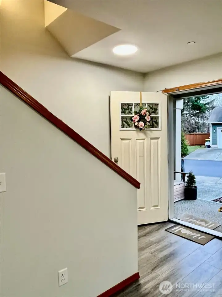 Front door leading to upstairs and main floor
