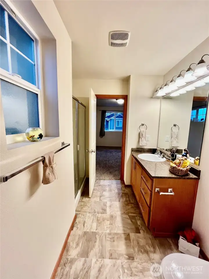 Primary bathroom with granite countertop
