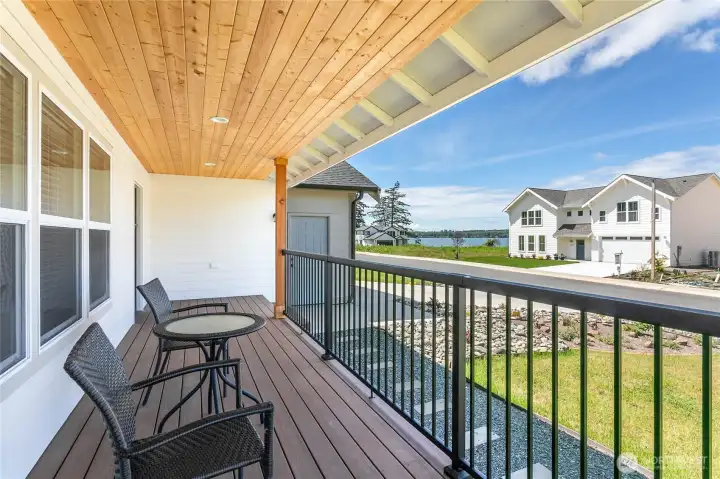 Serene waterfront vista from the porch, featuring calm waters and a picturesque landscape.
