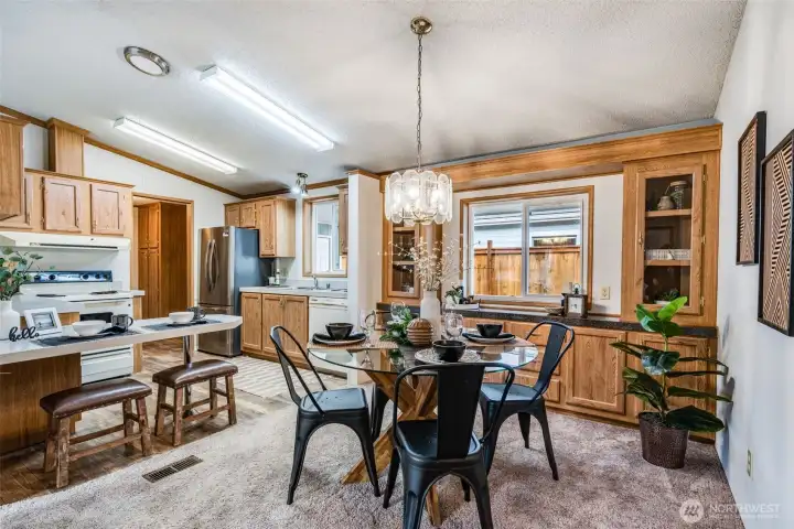 Another view showing the layout of the dining area and kitchen.