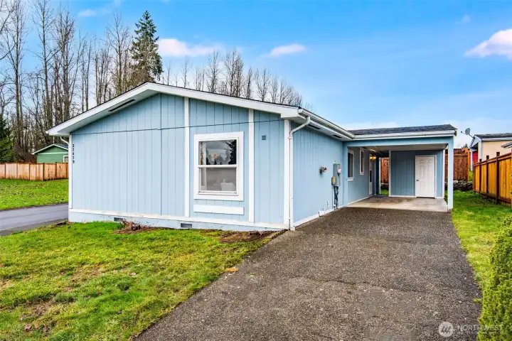 A private one car carport and long driveway make parking easy!
