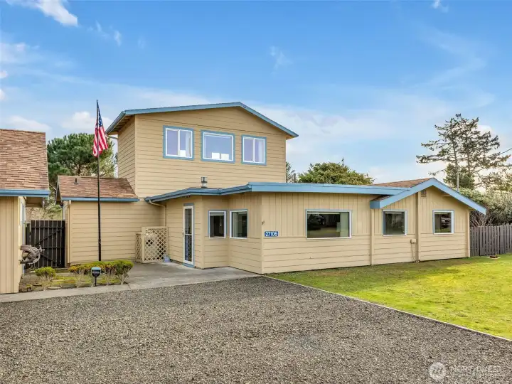 Two story home in Ocean Park with a detached garage & shop with ocean views.