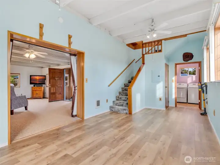 Dining area off the living room. This room leads you upstairs, or into the 3/4 bath with laundry space on the main floor. It also has a slider that will take you outside to the back porch.