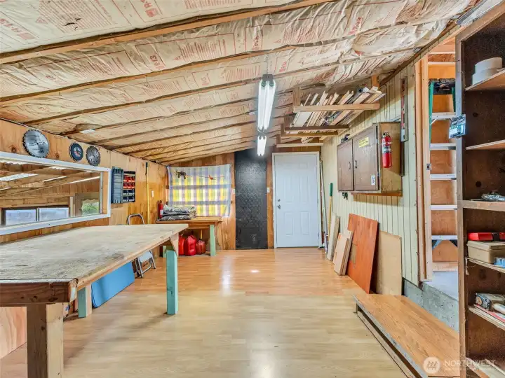 Large two car garage with work space.