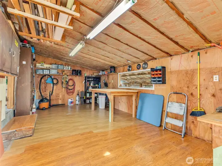 Large two car garage with work space.