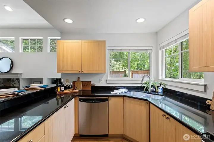 Kitchen overlooks greenbelt outside