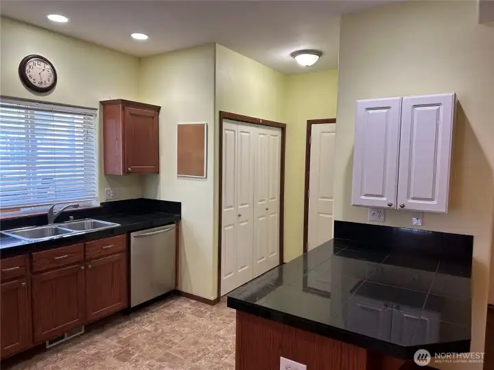 Washer and dryer hook ups behind the white double doors.