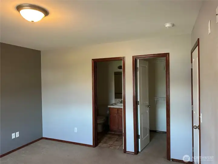 Primary bedroom with full bathroom and walk in closet.