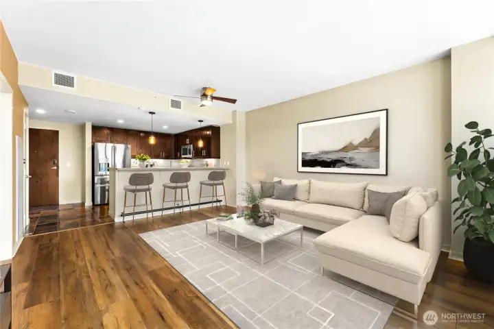 A dining room table can easily fit under the ceiling fan and light fixture shown here. This home is so well maintained, you will think it's brand new.