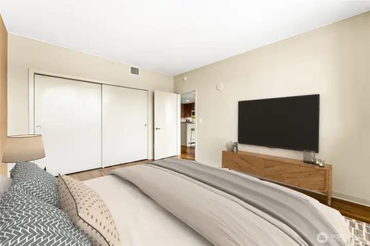 The dual closets open to an awesome wardrobe space.