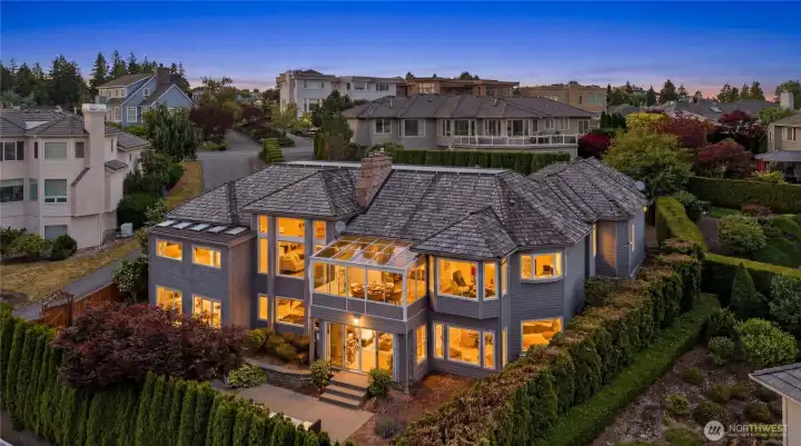 Rear view of home, with walls of windows. Rear view of home, with walls of windows.