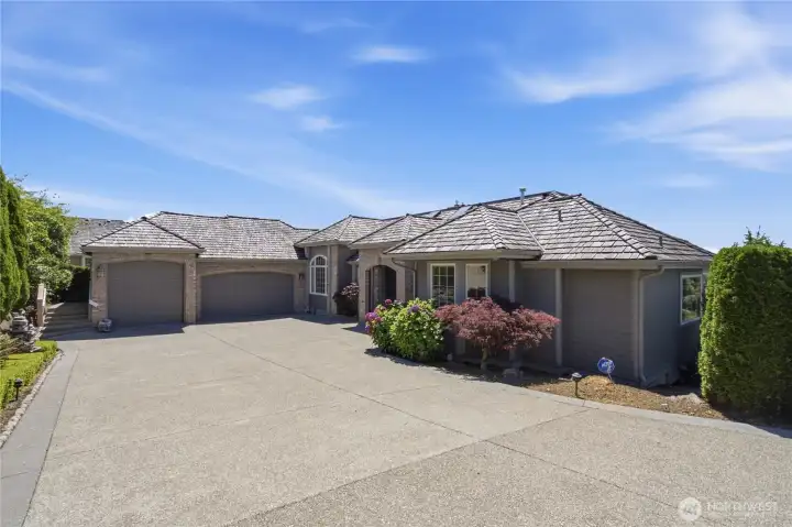 Front of home with huge driveway and 3-car garage. Front of home with huge driveway and 3-car garage.