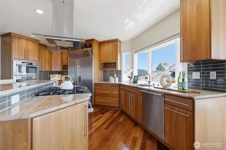 Kitchen with high-end appliances and center island. Kitchen with high-end appliances and center island.