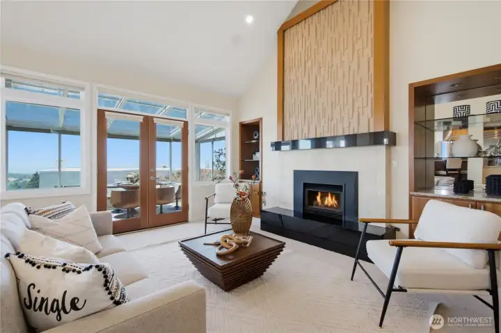 Family room with vaulted ceiling, gas fireplace and access to sunroom. Family room with vaulted ceiling, gas fireplace and access to sunroom.