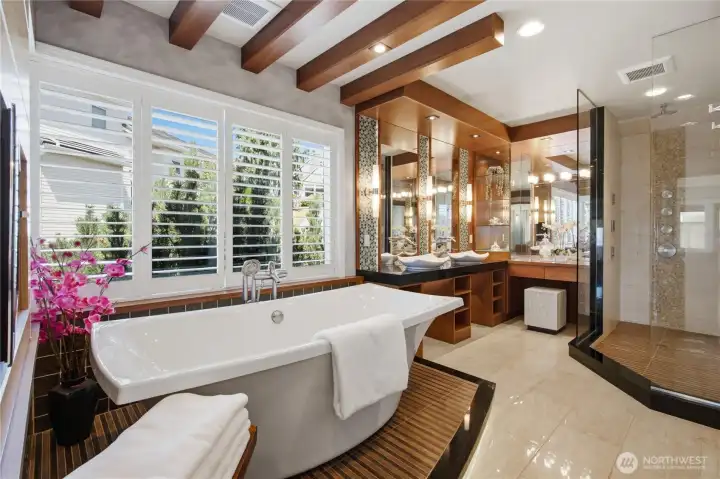 Luxurious primary bath with heated floors, heated tower rack and dressing table. Luxurious primary bath with heated floors, heated tower rack and dressing table.