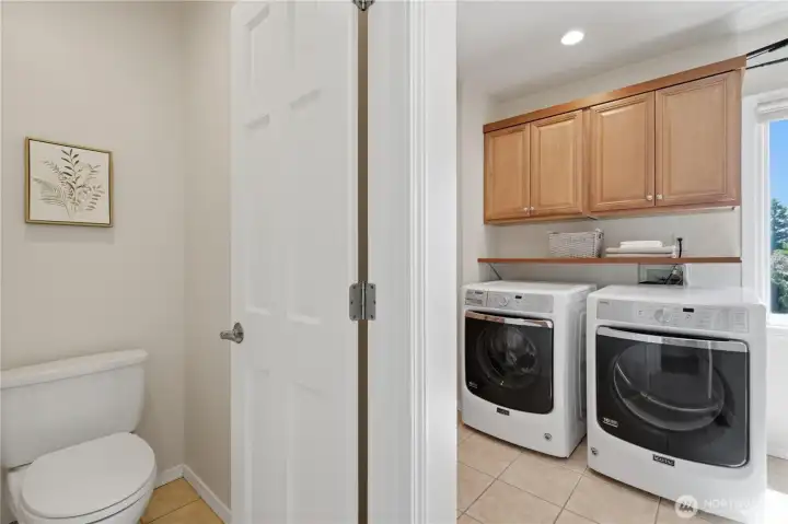 Laundry room on main floor with sink and toilet closet. Laundry room on main floor with sink and toilet closet.