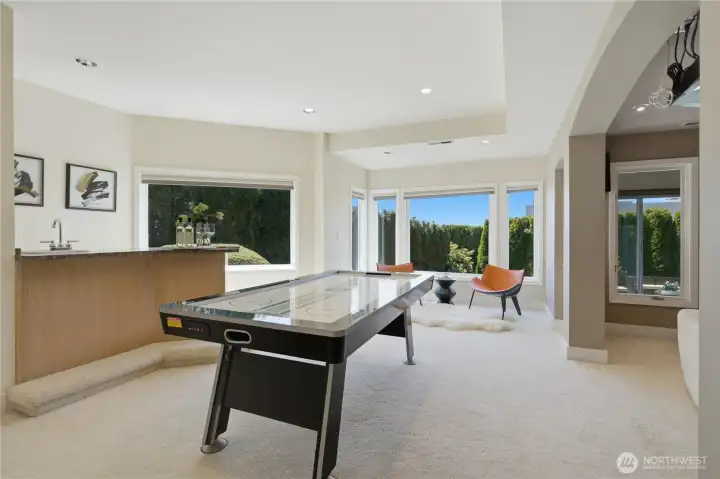 Lower level rec room with wet bar. Lower level rec room with wet bar.