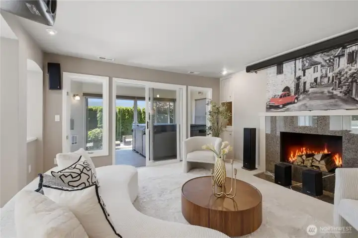 Lower level entertainment room with fireplace, and access to indoor hot tub. Lower level entertainment room with fireplace, and access to indoor hot tub.