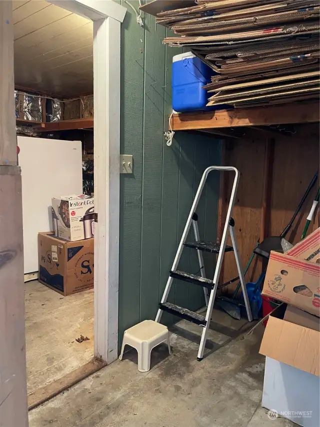 Storage building attached to carport.