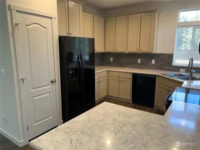 Another view of the kitchen and pantry.