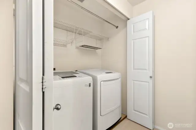 Laundry area with storage.