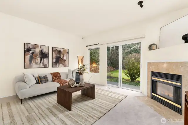 Main living space overlooks private green space.