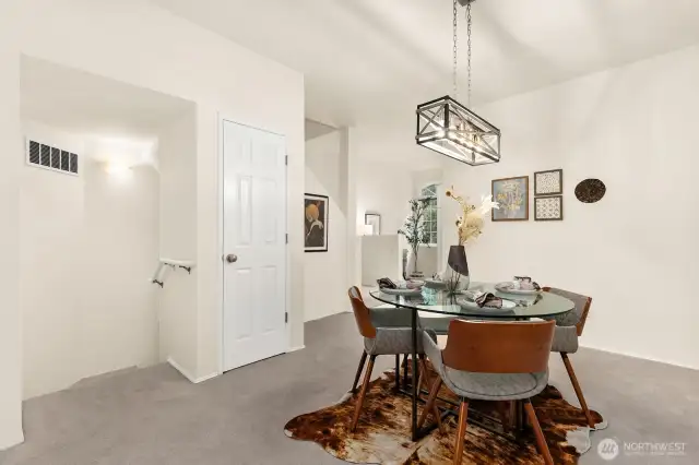 Stairs on left  lead down to entry & garage. Stairs on right lead up to bedrooms & laundry.