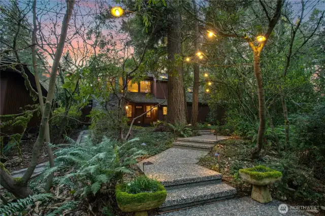 Lush entrance with abundant LED lighting above and below…